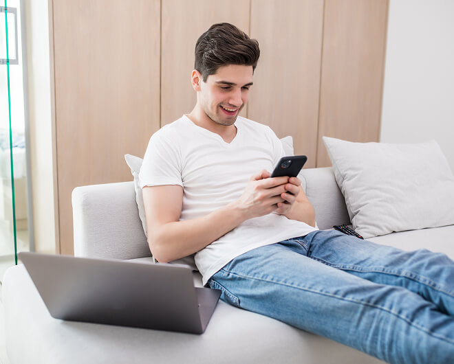 Person using mobile phone with 5G network